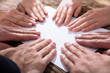 © Andrey Popov - Hands Touching White Paper
