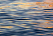 Beautiful Sunset Reflections On A Silky, Reflective Water Surface.