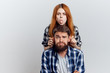 © SHOTPRIME STUDIO - Beautiful young woman and guy with a beard on white isolated background, repair, housework, painting, building materials