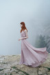 © SHOTPRIME STUDIO - Beautiful young woman in a long dress on a mountainside