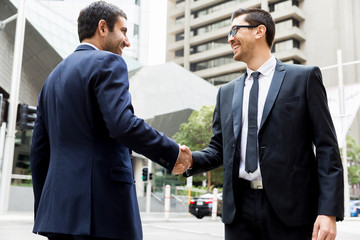 Two businessmen shaking their hands