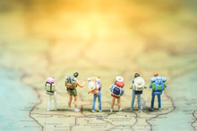 Selective Focus. Miniature People : Small Traveler Figures With Backpack Standing On South Africa Map / Geography Of South Africa, Exploring On Earth Background Concept.