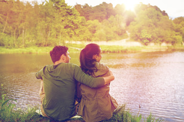 Canvas Print - happy couple hugging on lake or river bank