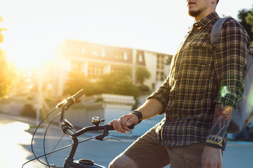 Wall Mural - Young Guy Cyclist With Bicycle Daily Routine Lifestyle