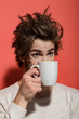 © Volodymyr - surprised man with cup of tea or coffee