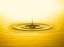 Close Up Of Golden Water Drop