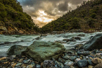 Sunset over river in the mountains 