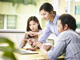 Wall Mural - asian business executives working together in office