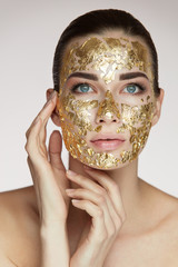 Woman Face Mask. Beautiful Sexy Girl With Cosmetic Gold Mask