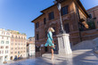 young attractive blond woman barefoot dancing in the spanish square in Rome
