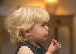 © Calypso Photo - Blond girl with chocolate on face pondering whilst waiting for food