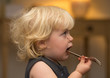 © Calypso Photo - Blond girl with chocolate on face waiting for food