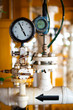 pressure gauge,analog pressure gauge measuring gas pressure. Pipes and valves at oil and gas industrial plant.