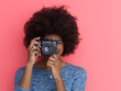 © .shock - young black girl taking photo on a retro camera