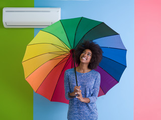 Poster - young black woman holding a colorful umbrella