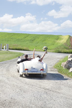 Newlywed Bride And Groom Drive Away In Getaway Car After Wedding