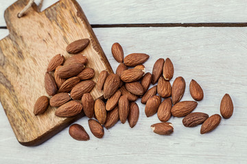 Wall Mural - Almonds on a wooden background