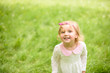 © Nestyda - Beautiful child play in the summer. Green nature background