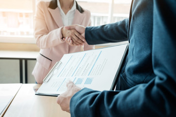 Wall Mural - of successful business team shaking hands with each other in the office, job interview concept