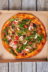 Wall Mural - Pizza with meat and arugula.