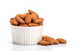 the fresh almonds in white cup on white background