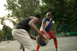 © antgor - African american man friends playing on basketball court. Real authentic activity.