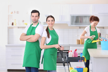 Wall Mural - Cleaning service team working in kitchen