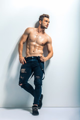 full length portrait of a sexy muscular shirtless man