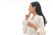 © kaew6566 - Side of Beautiful Asian young woman standing holding cup of coffee on isolated white background.