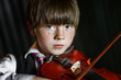 © 31etc - Attractive boy playing violin, studio shooting