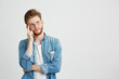 © Cookie Studio - Portrait of dreamy young man thinking looking up with hand on cheek over white background.