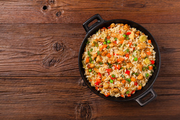 Wall Mural - Fried rice with chicken. Prepared and served in a wok.