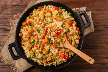 Fried rice with chicken. Prepared and served in a wok.