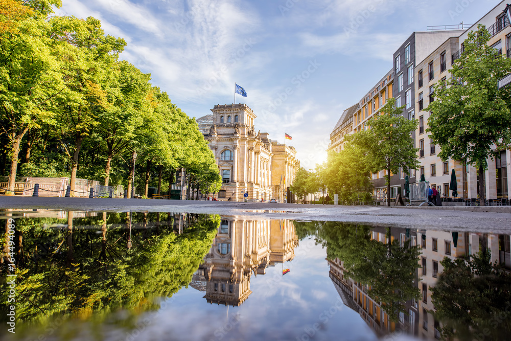Obraz na płótnie Street view with Reichtag building and beautiful reflection during the morning light in Berlin city w salonie