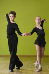 Boy and girl dancing ballroom dance