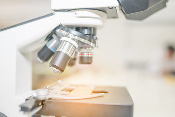 Wall Mural - Microscope on the table in laboratory room with laboratory equipment