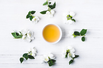 Wall Mural - Green tea with a jasmine in white cups. Negative space for text or disign