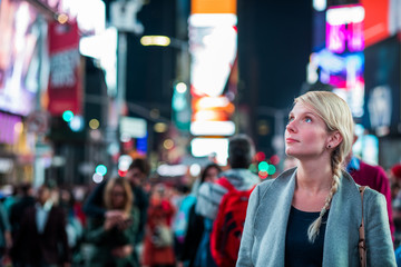 Impressed Woman in the Middle of Times Square at Night,