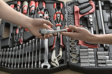 Wall Mural - Open toolbox and male hands 