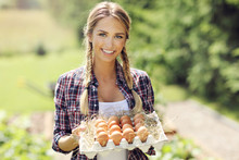 Young Woman With Fresh Organic Eggs