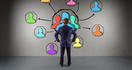 Wall Mural - Businessman watching social network sketch on a wall 3D rendering