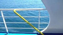 Looping Background Of A Moving Ship With Blue Sea Behind The White Railing, Easy To Set As A Side Plate For Travel Clips Or Vacation Videos