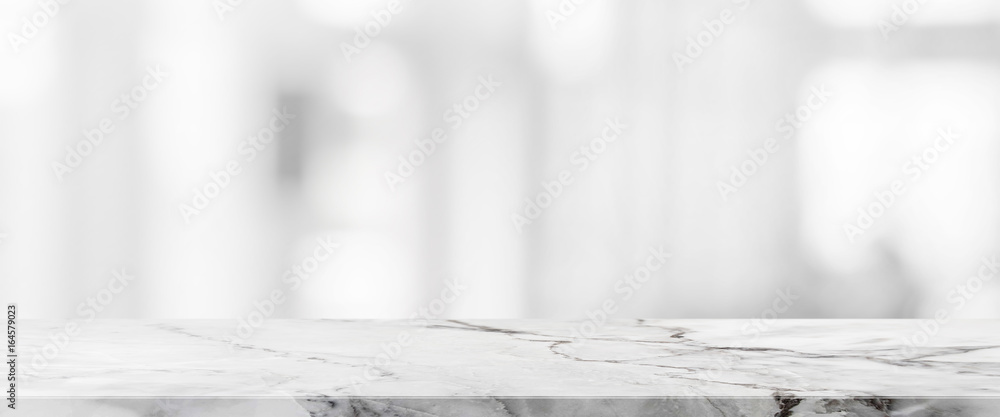 White stone marble table top and blurred abstract background from interior building banner background - can used for display or montage your products. - obrazy, fototapety, plakaty 