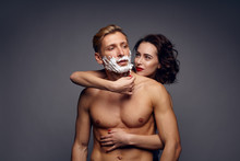 Woman Shaving A Man