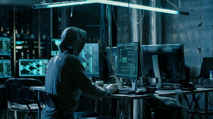 Aufkleber - Hooded Hacker Using His Comuter with Different Information to Break into Corporate Data Servers and Infects them with Virus. His Hideout Place has Dark Atmosphere, Multiple Displays.
