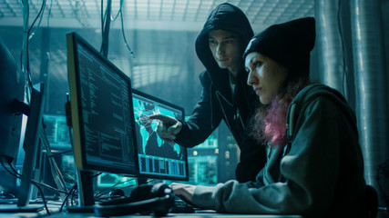 Aufkleber - Team of Boy and Girl Hackers Organize Advanced Virus Attack on Corporate Servers. They Work Together. Place is Dark and Has Multiple displays.