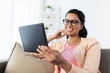 © Syda Productions - happy indian woman with tablet pc at home