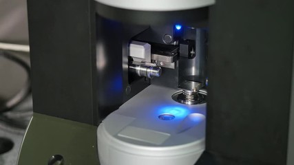 Wall Mural - Close Up Of 3D Printer Operating In Design Studio. Electronic three dimensional plastic printer during work. 3D printer in process printing an object