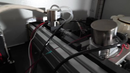 Wall Mural - Close Up Of 3D Printer Operating In Design Studio. Electronic three dimensional plastic printer during work. 3D printer in process printing an object