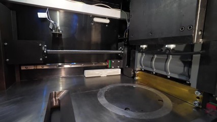 Wall Mural - Close Up Of 3D Printer Operating In Design Studio. Electronic three dimensional plastic printer during work. 3D printer in process printing an object